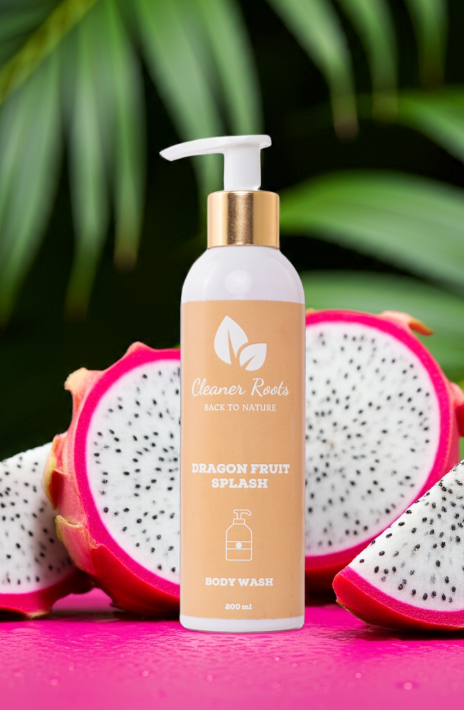 Cleaner Roots Dragon Fruit Splash Body Wash with fresh white dragon fruit on pink background - sulfate-free body wash, gentle on skin, lightens dullness
