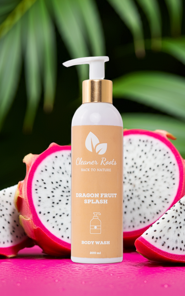 Cleaner Roots Dragon Fruit Splash Body Wash with fresh white dragon fruit on pink background - sulfate-free body wash, gentle on skin, lightens dullness