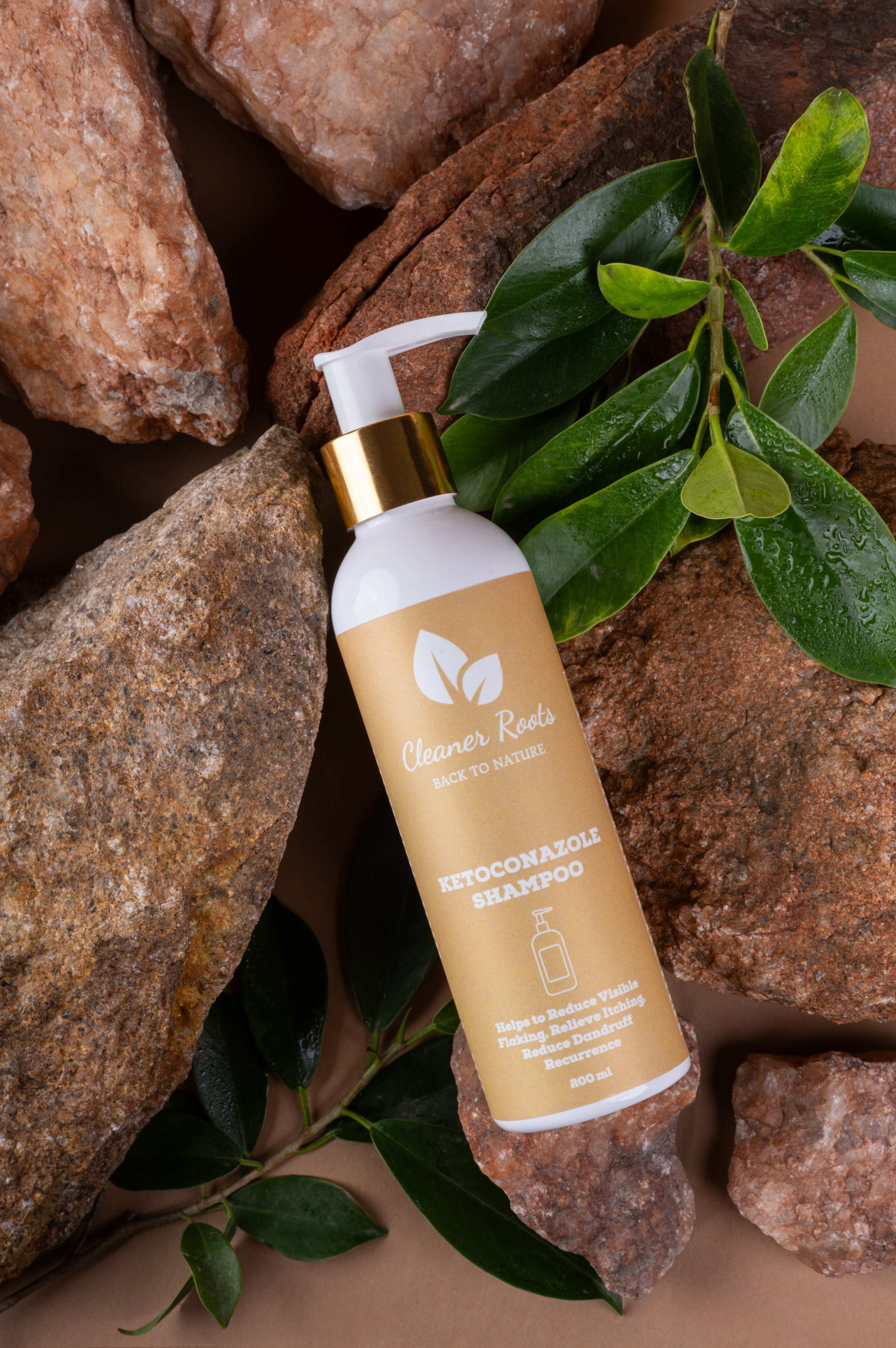 Cleaner Roots Ketoconazole Anti-Dandruff Shampoo for effective scalp care and fungal treatment, shown with natural stones