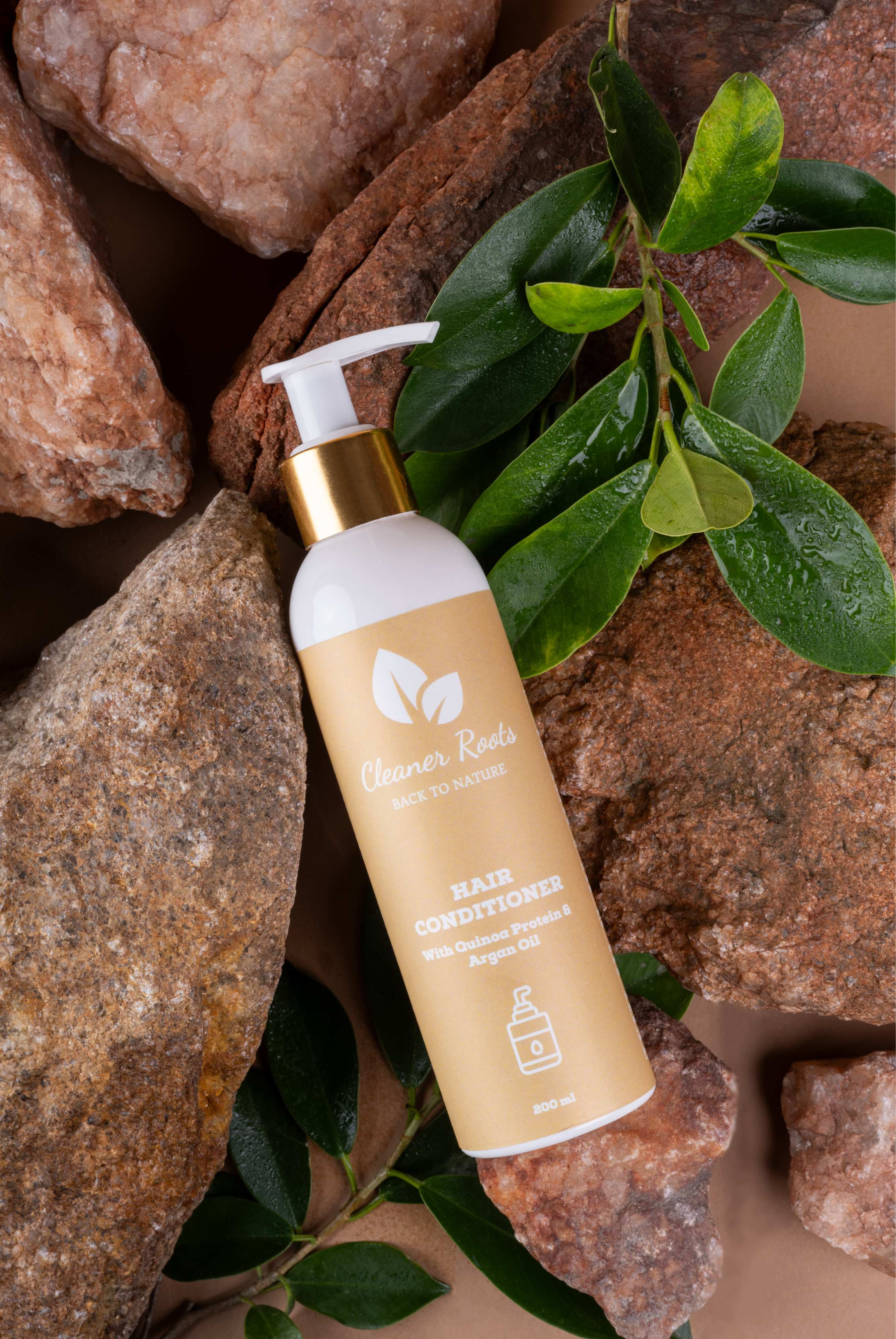 Cleaner Roots hair conditioner with quinoa protein and argan oil on natural background