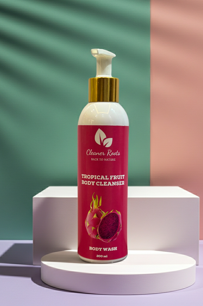 Tropical fruit body cleanser bottle on a white pedestal with a colorful background