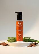 Sunscreen bottle with aloe vera leaves on a light background