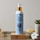 Body cleanser bottle with a blue label on a wooden block against a neutral background