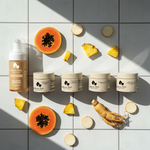 Cosmetic products with papaya, pineapple, and ginger on a tiled background