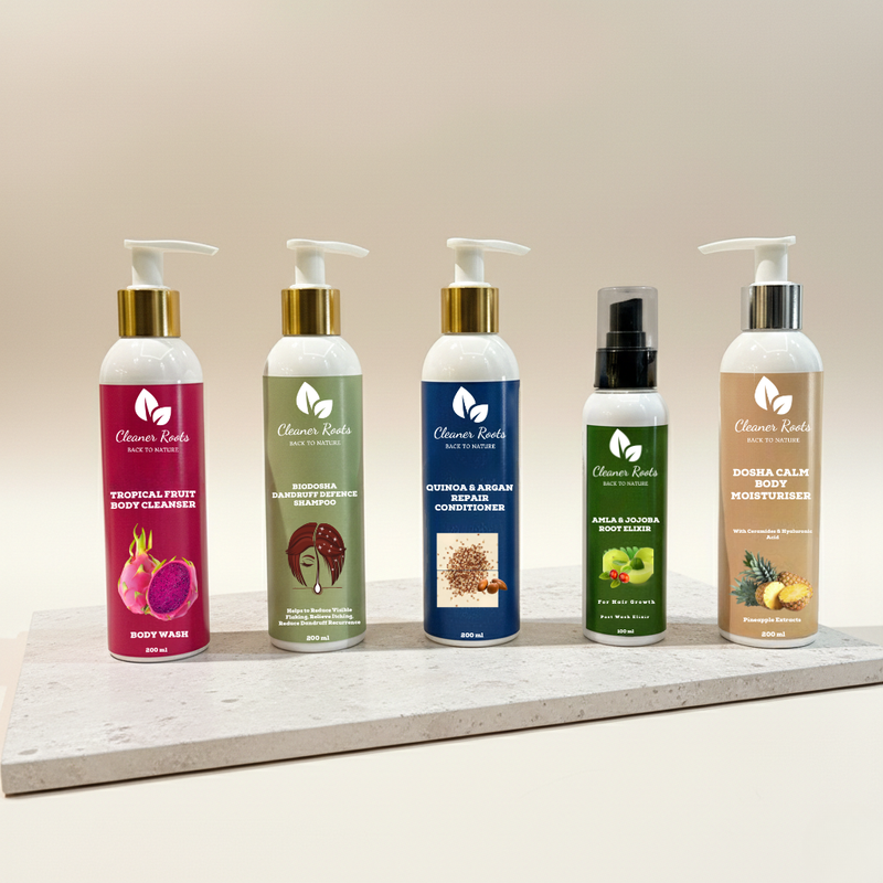 Set of five skincare products with pump dispensers on a wooden shelf against a beige background.