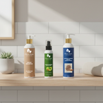 Three hair care products on a bathroom counter with a tiled wall background