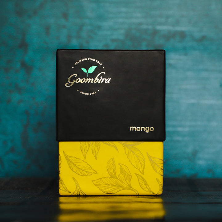 Goombira mango tea against a blue background